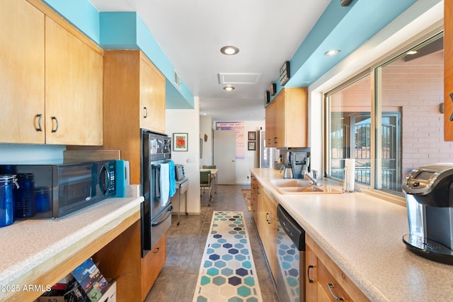 kitchen with light brown cabinetry, a sink, light countertops, black microwave, and stainless steel dishwasher