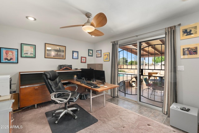 office featuring carpet and a ceiling fan