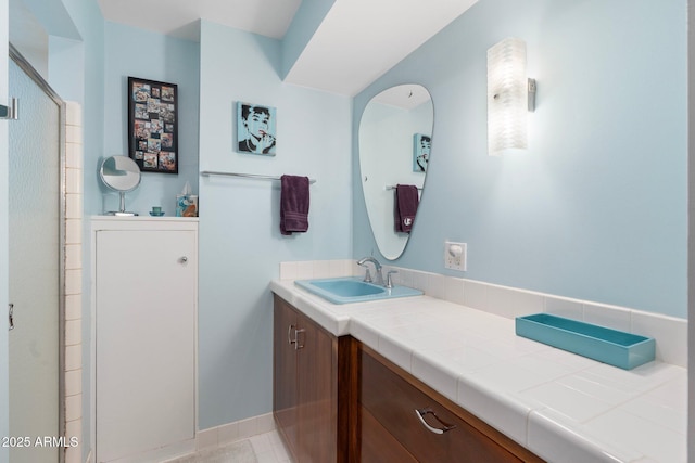 full bath featuring vanity and a shower stall