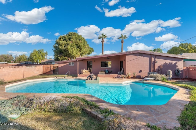 view of pool with a fenced in pool, a diving board, a patio, and fence