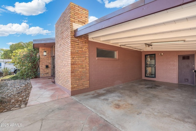 view of patio / terrace featuring a carport