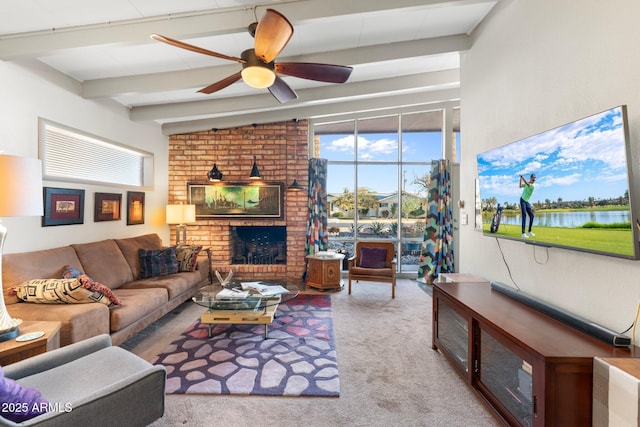 carpeted living area featuring lofted ceiling with beams, a ceiling fan, and a fireplace