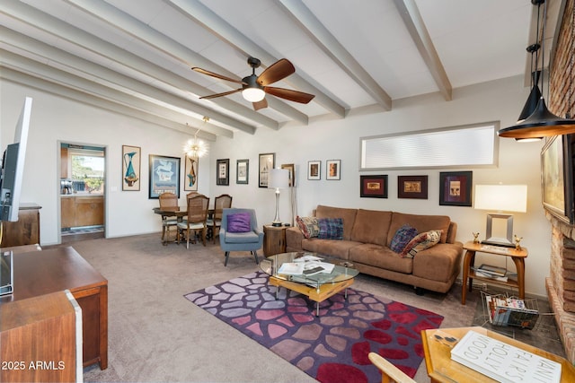 living room with carpet flooring, ceiling fan with notable chandelier, and vaulted ceiling with beams