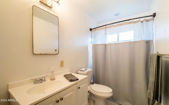 bathroom with vanity, toilet, and a shower with shower curtain