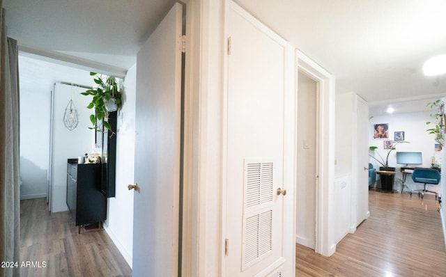 corridor featuring light hardwood / wood-style floors