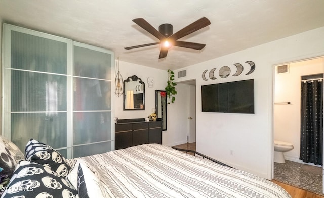 2047 W Maryland Ave, Phoenix, AZ 85015 - unfurnished bedroom featuring ensuite bath, ceiling fan, visible vents, and wood finished floors