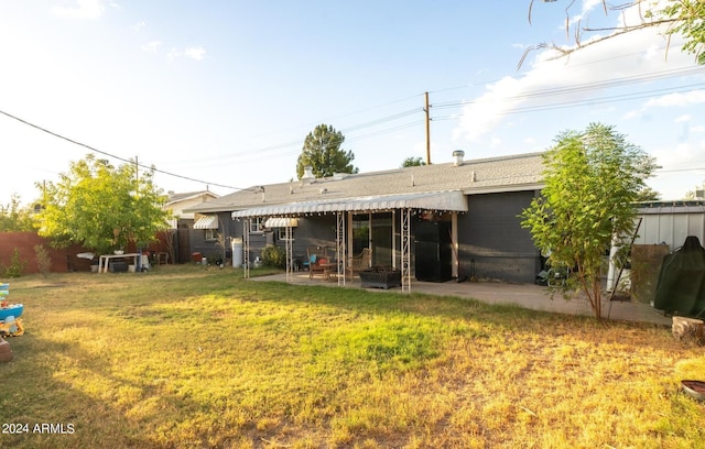 2047 W Maryland Ave, Phoenix, AZ 85015 - rear view of house featuring fence, a yard, and a patio area