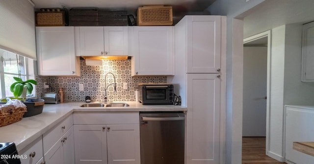 kitchen with white cabinetry and stainless steel dishwasher