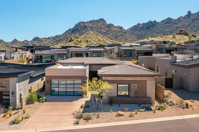 view of front of house featuring a mountain view and a garage