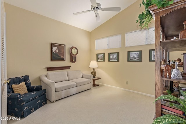 living area with a ceiling fan, vaulted ceiling, carpet, and baseboards