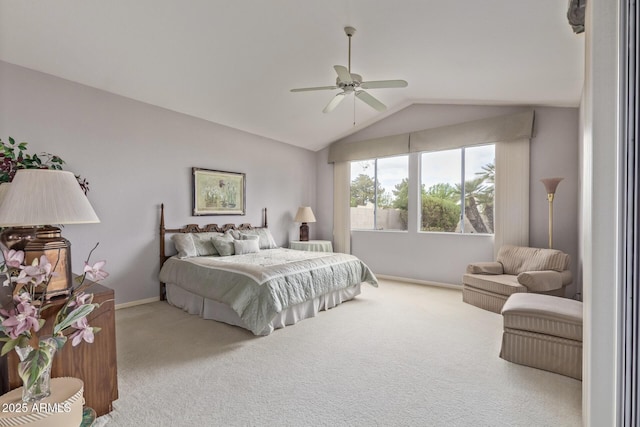 carpeted bedroom featuring baseboards, a ceiling fan, and vaulted ceiling