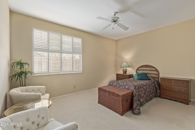 bedroom with baseboards, a ceiling fan, and carpet