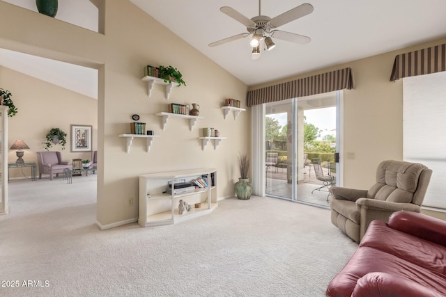 carpeted living room with high vaulted ceiling, baseboards, and ceiling fan