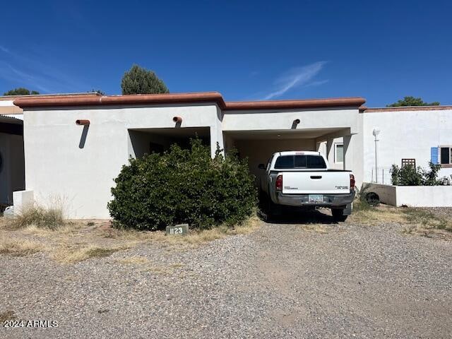 view of front of home with a carport