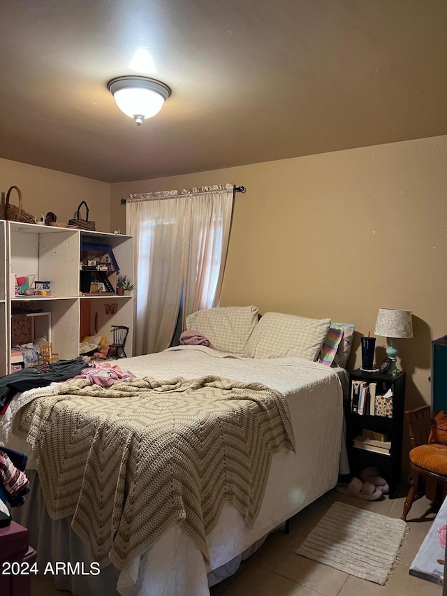 bedroom featuring light tile patterned floors