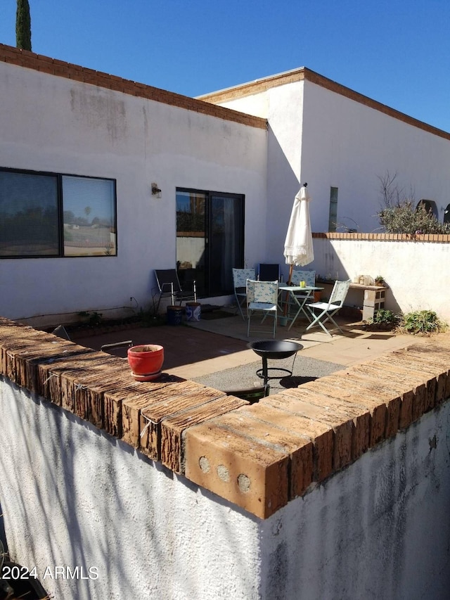 rear view of property with a patio area