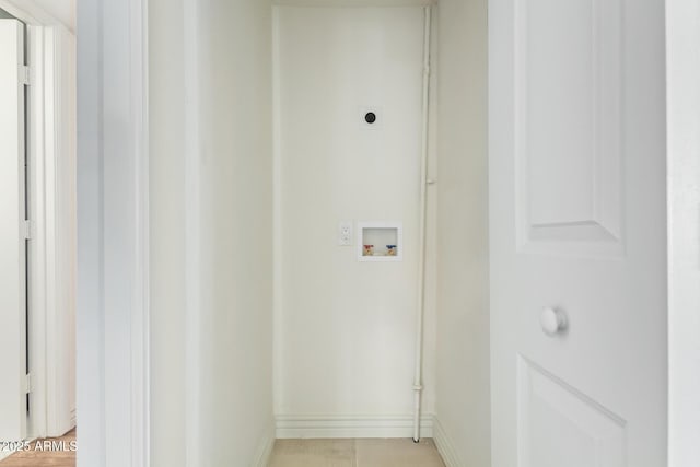 washroom featuring electric dryer hookup, baseboards, washer hookup, and laundry area