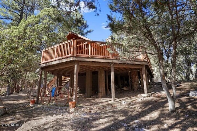 rear view of house featuring a deck