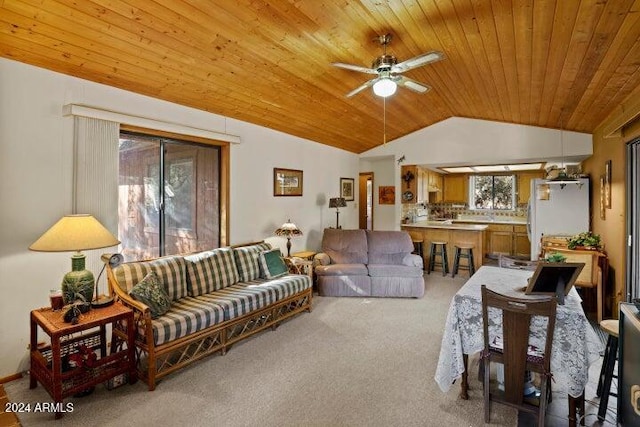 living room with plenty of natural light, light colored carpet, lofted ceiling, and wooden ceiling