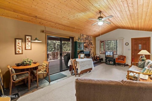 living room featuring wood ceiling, ceiling fan, a healthy amount of sunlight, and vaulted ceiling