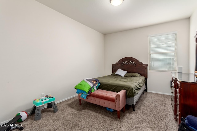 bedroom with baseboards and carpet floors