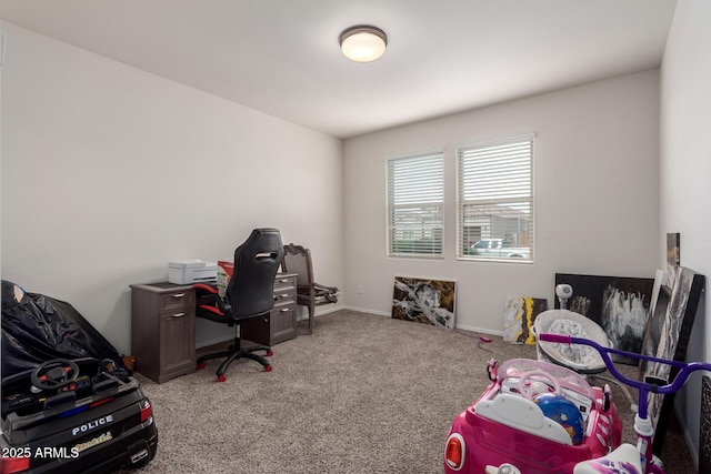 carpeted bedroom featuring baseboards