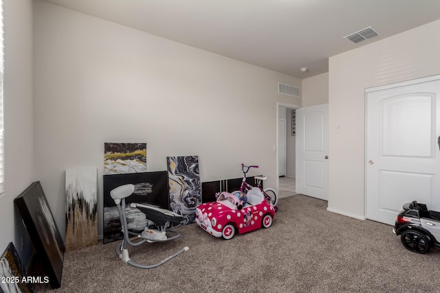 rec room featuring visible vents and carpet floors