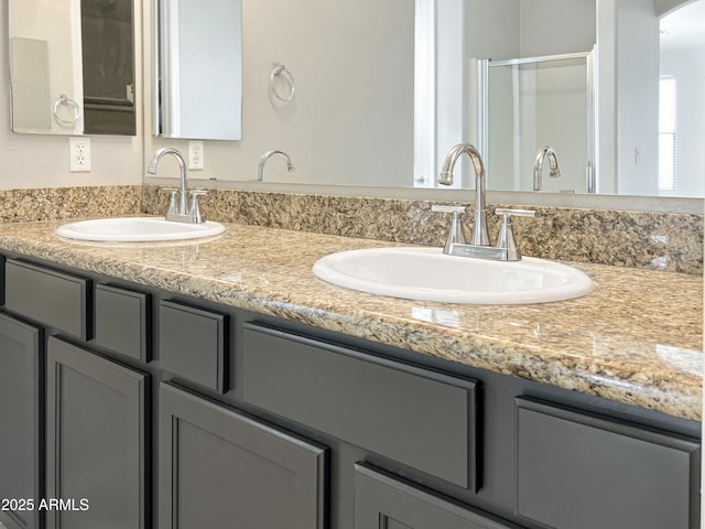 full bathroom featuring double vanity and a sink