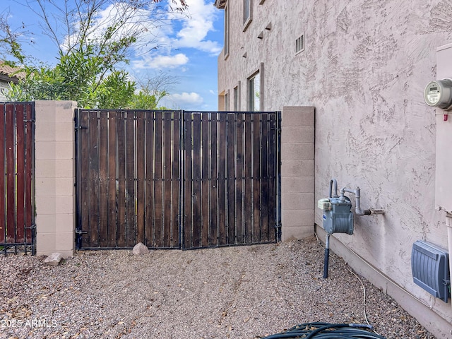 view of gate featuring fence