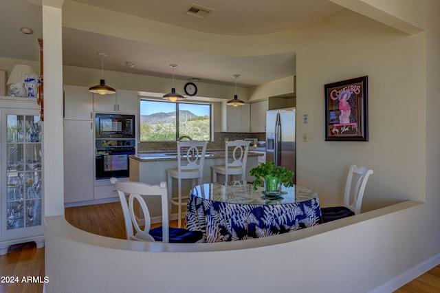 dining area with light hardwood / wood-style floors