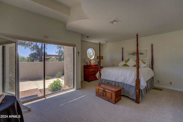 carpeted bedroom featuring access to outside