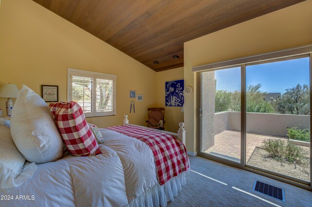 bedroom featuring vaulted ceiling, dark carpet, access to exterior, and wooden ceiling