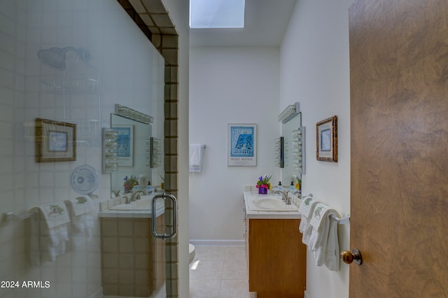 bathroom with toilet, tile flooring, and vanity