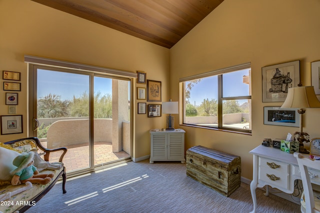 interior space featuring wood ceiling, light carpet, and high vaulted ceiling