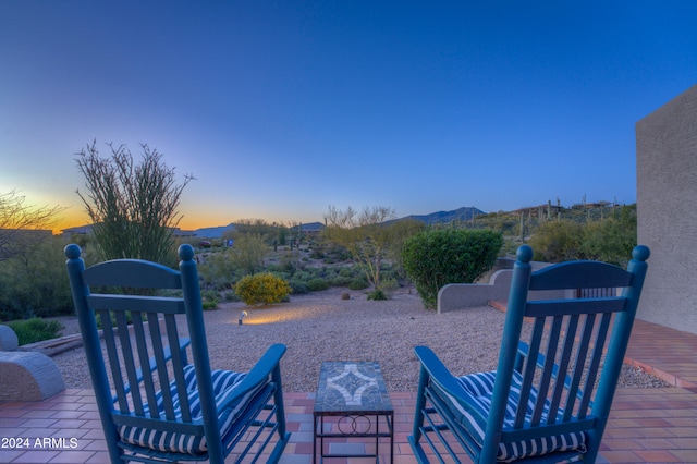 view of patio terrace at dusk