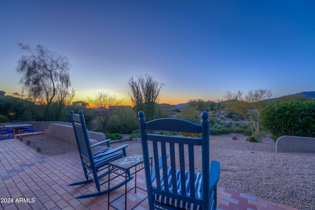 view of patio terrace at dusk