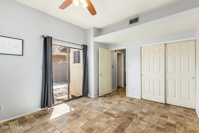 1601 E Cindy St, Chandler, AZ 85225 - unfurnished bedroom featuring baseboards, stone tile floors, access to outside, and visible vents