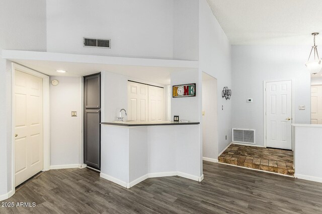 1601 E Cindy St, Chandler, AZ 85225 - kitchen with dark wood-style floors, visible vents, and a towering ceiling