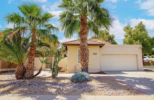 1601 E Cindy St, Chandler, AZ 85225 - mediterranean / spanish-style home featuring a gate, an attached garage, a tile roof, concrete driveway, and stucco siding