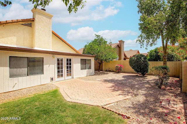 1601 E Cindy St, Chandler, AZ 85225 - rear view of house with a fenced backyard, a patio, stucco siding, and french doors