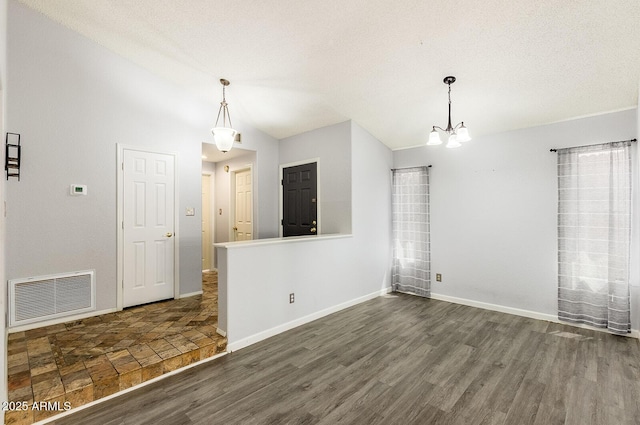 1601 E Cindy St, Chandler, AZ 85225 - spare room with lofted ceiling, baseboards, visible vents, a chandelier, and dark wood-style floors