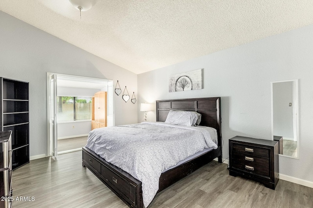 1601 E Cindy St, Chandler, AZ 85225 - bedroom featuring vaulted ceiling, a textured ceiling, baseboards, and wood finished floors
