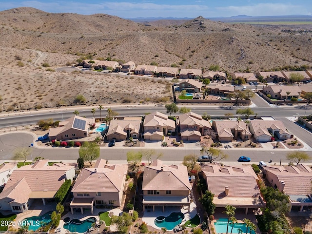 birds eye view of property with a mountain view and a residential view