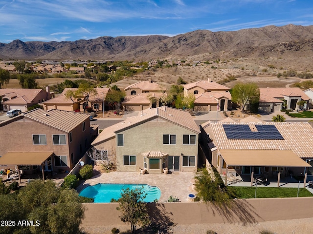 exterior space featuring a mountain view and a residential view