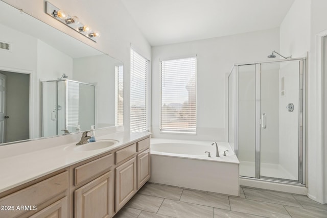 full bathroom with visible vents, a shower stall, vanity, and a bath