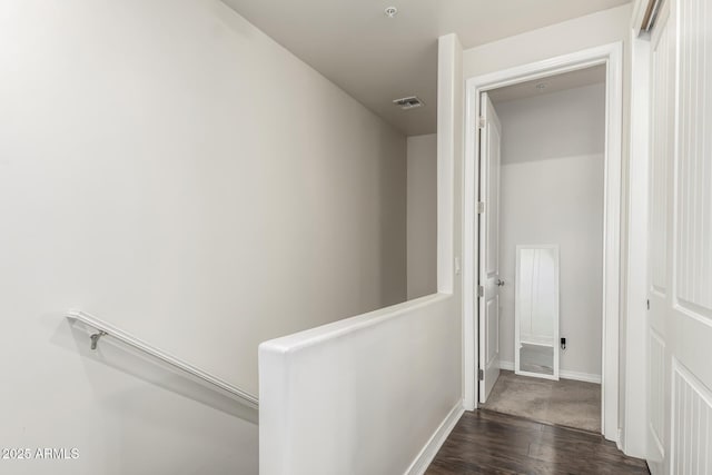 hall with dark hardwood / wood-style floors