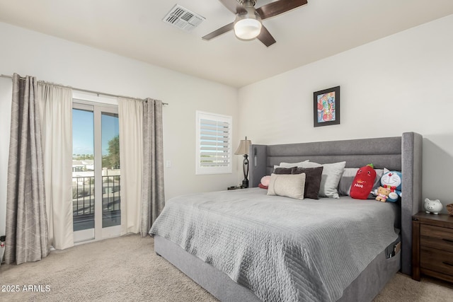 bedroom featuring access to exterior, light colored carpet, and ceiling fan