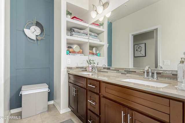 bathroom with tile patterned floors and vanity