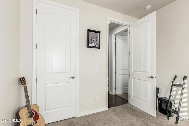 unfurnished bedroom featuring light carpet