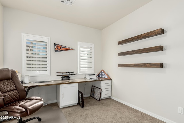 office space with light colored carpet